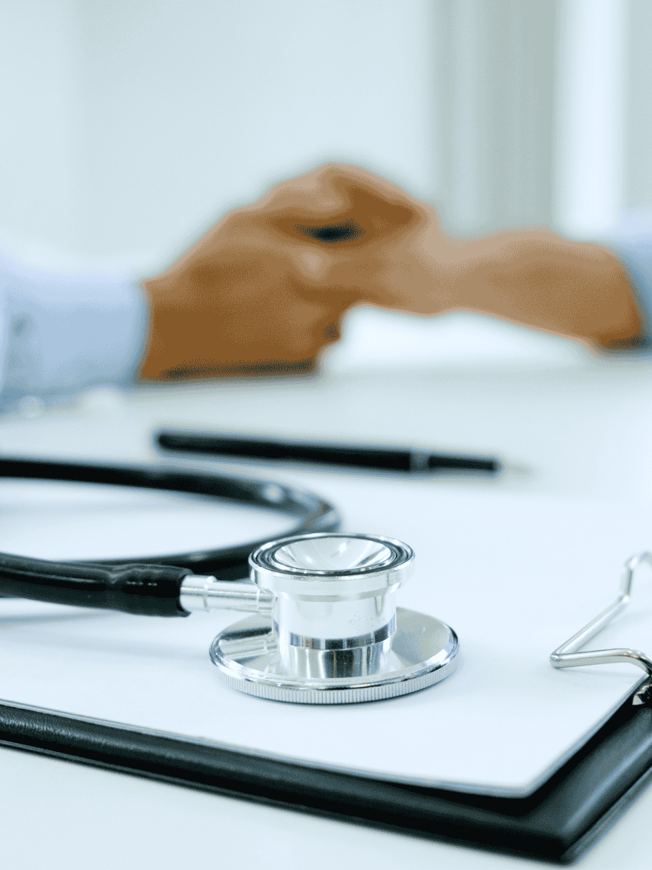 a close up picture of a stethoscope lying on a clipboard