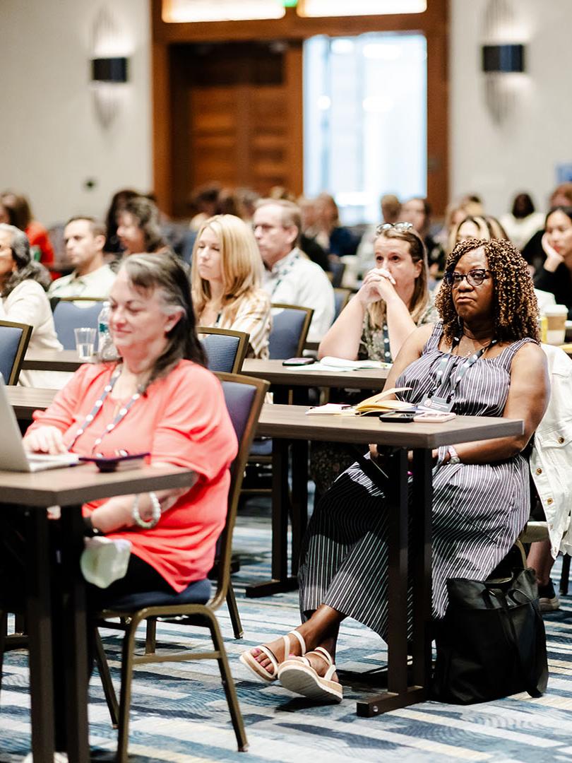 People listening to session about research