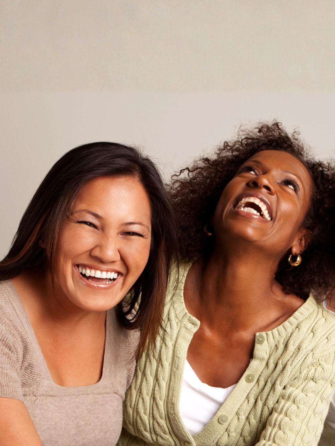 Three women smiling together