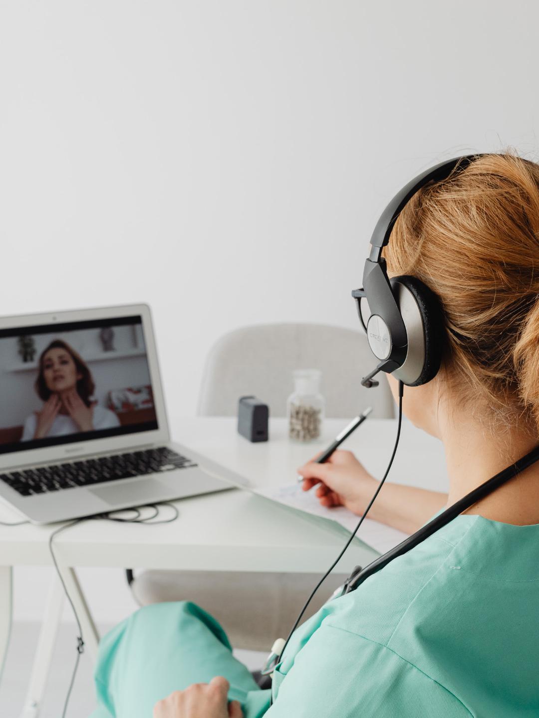 A woman watching a webinar