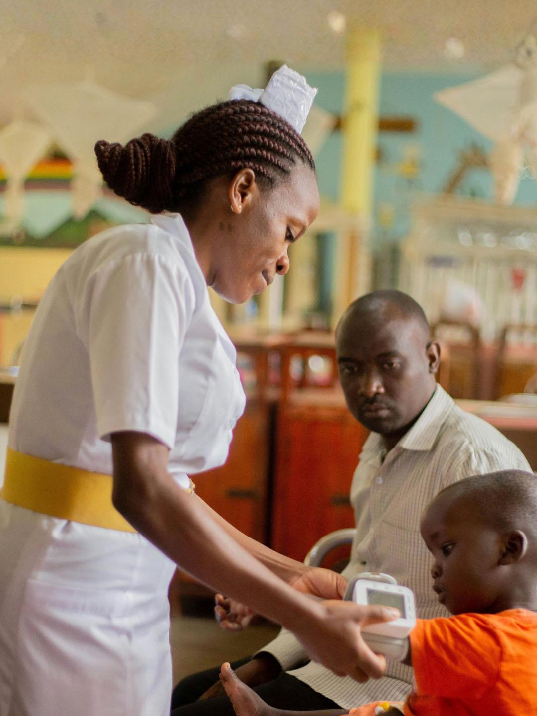 A healthcare provider helping a child