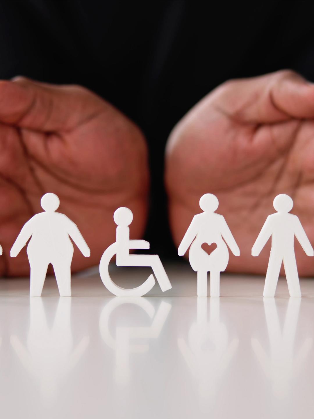 A pair of hands with cutouts of people