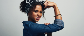 Women holding her arm in a strong position