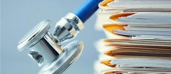 Medical documents under a stethosecope