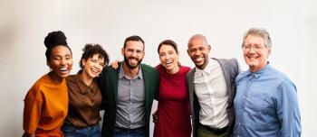 A diverse group of people smiling together