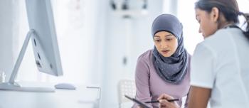 A muslim woman speaking with a healthcare provider