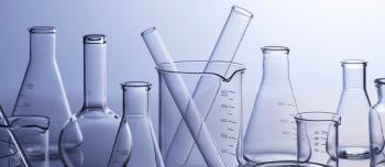 Beakers, Erlenmeyer flasks, test tubes, and burrettes on a table