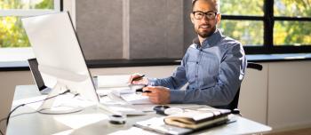 Man in wheelchair doing finances