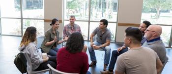 A group of people discussing mental health
