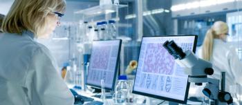 Female Scientist Conducting Research in Lab Analyzing Data