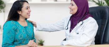 A doctor across from her patient