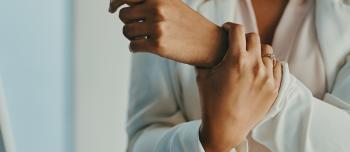 Woman Holding Her Wrist