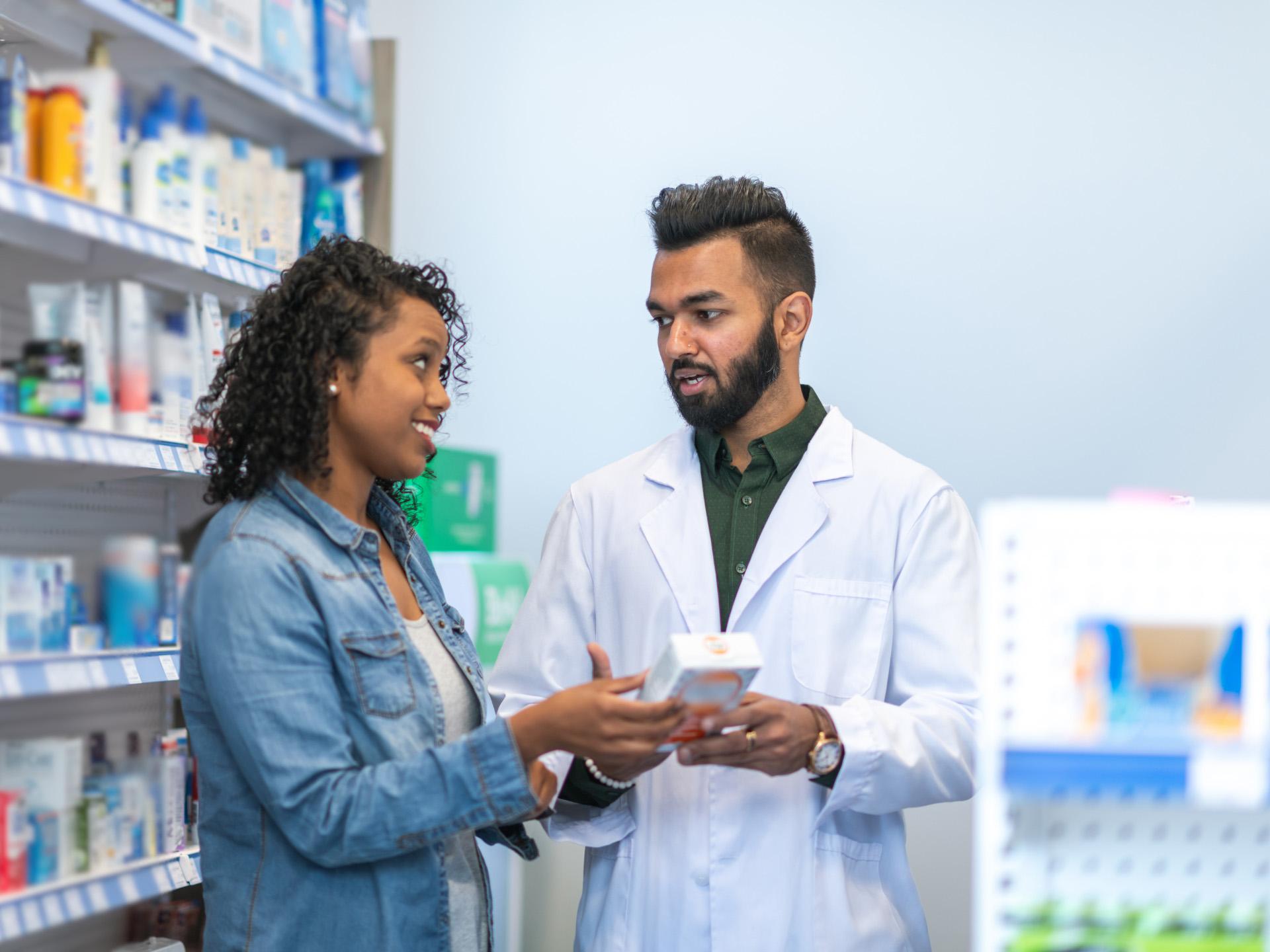 Woman speaking to pharmacist
