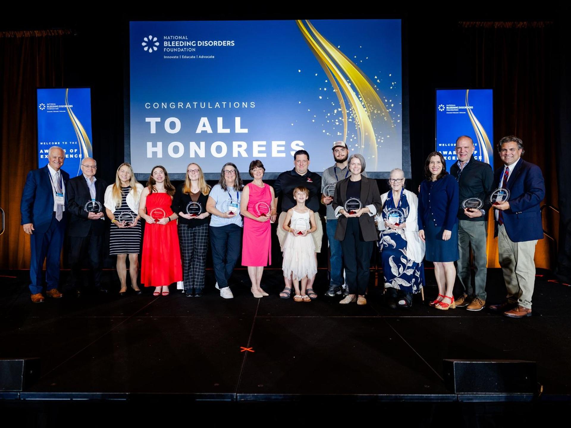 A group of awardees on stage at BDC 2026