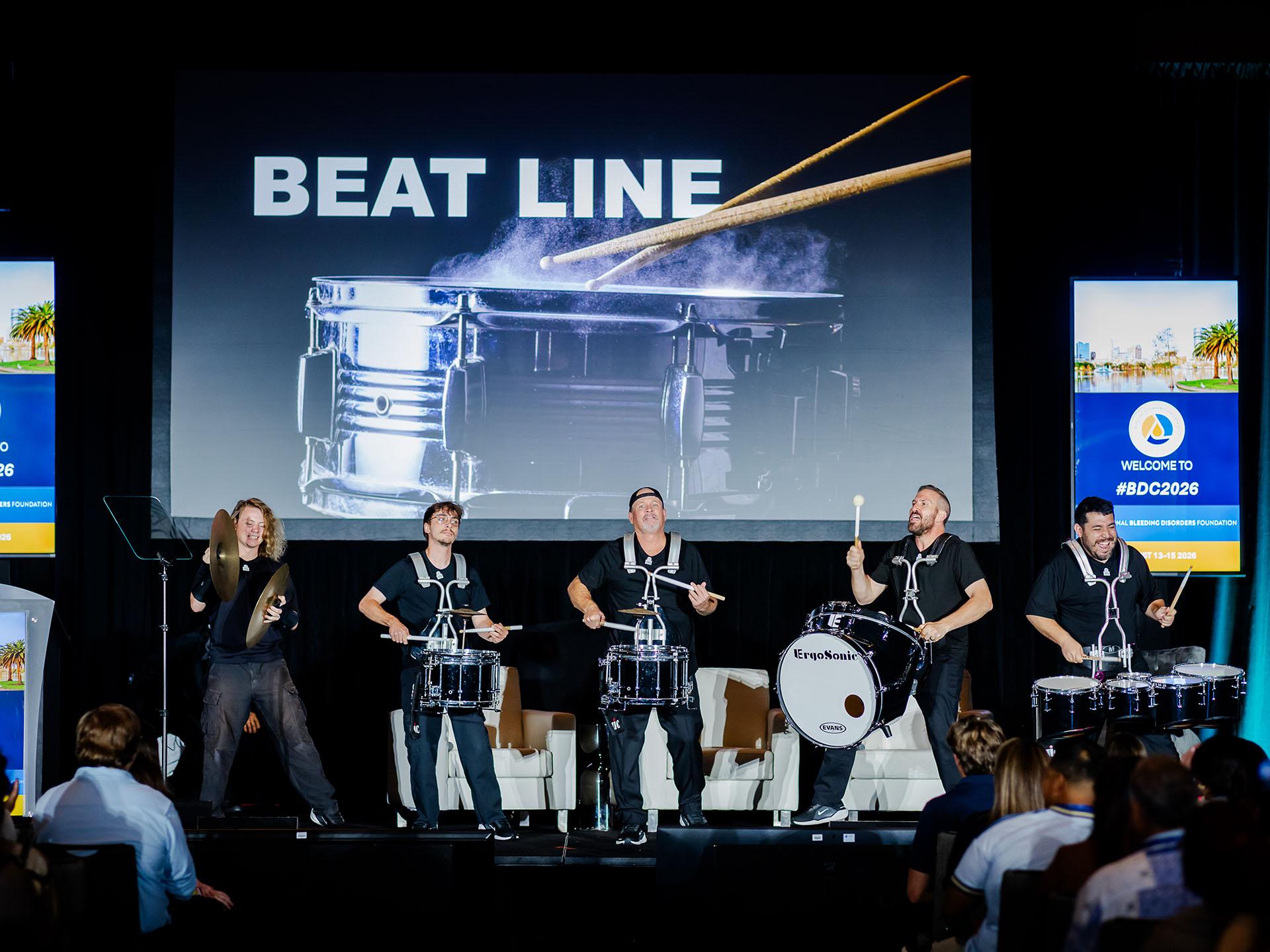 Drumline players on a stage