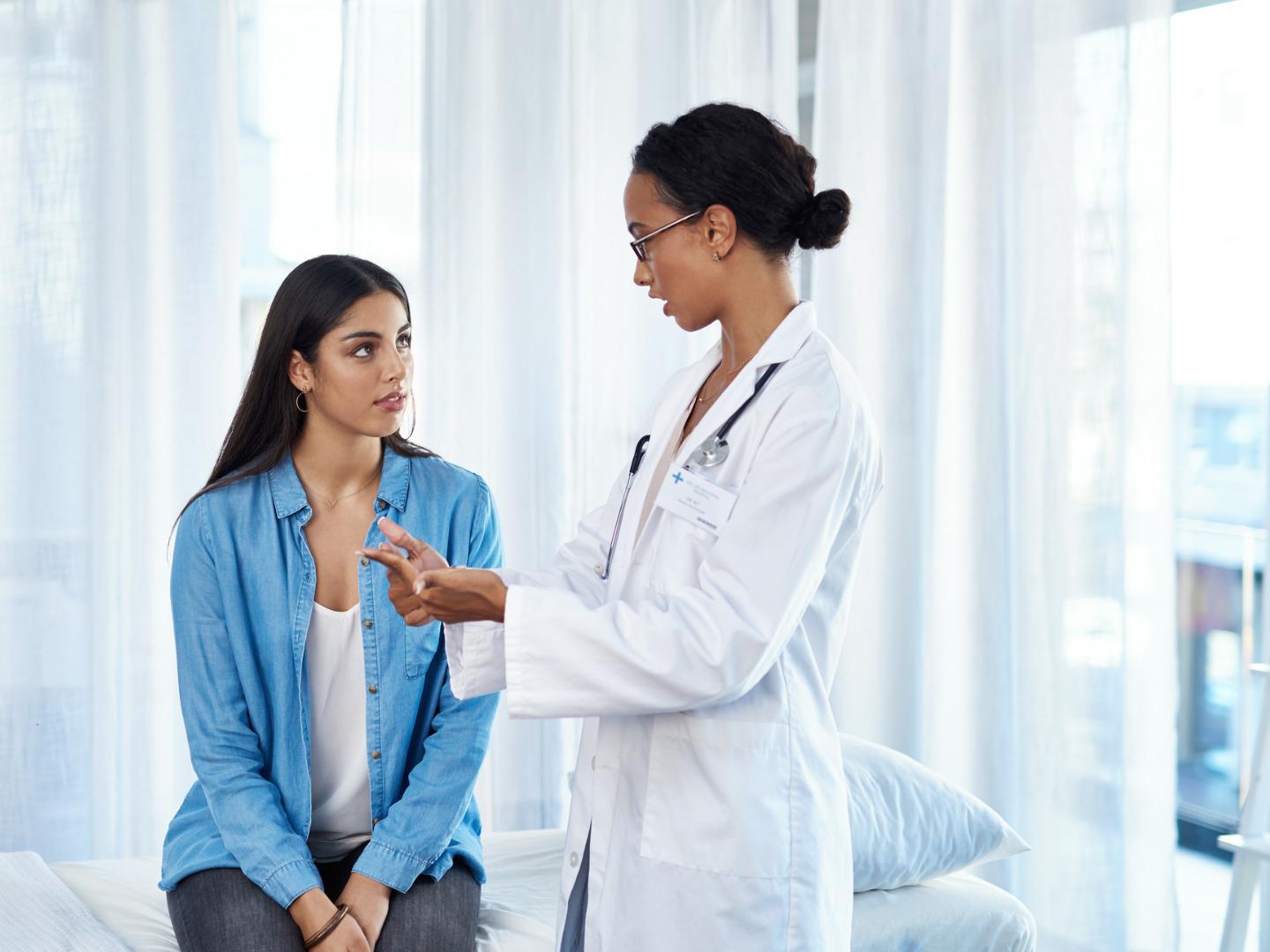 A woman listening to her doctor